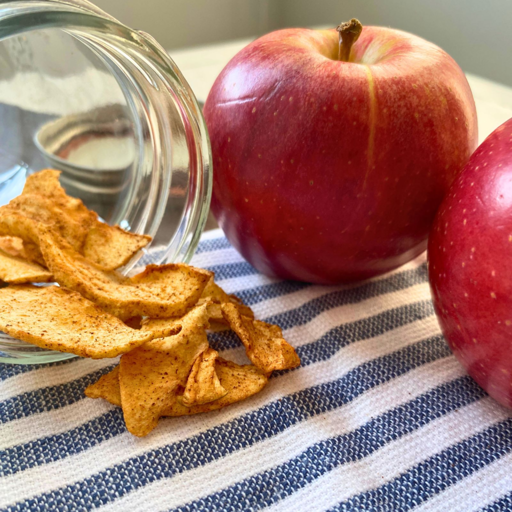 Apples with dried apple slices in a jar