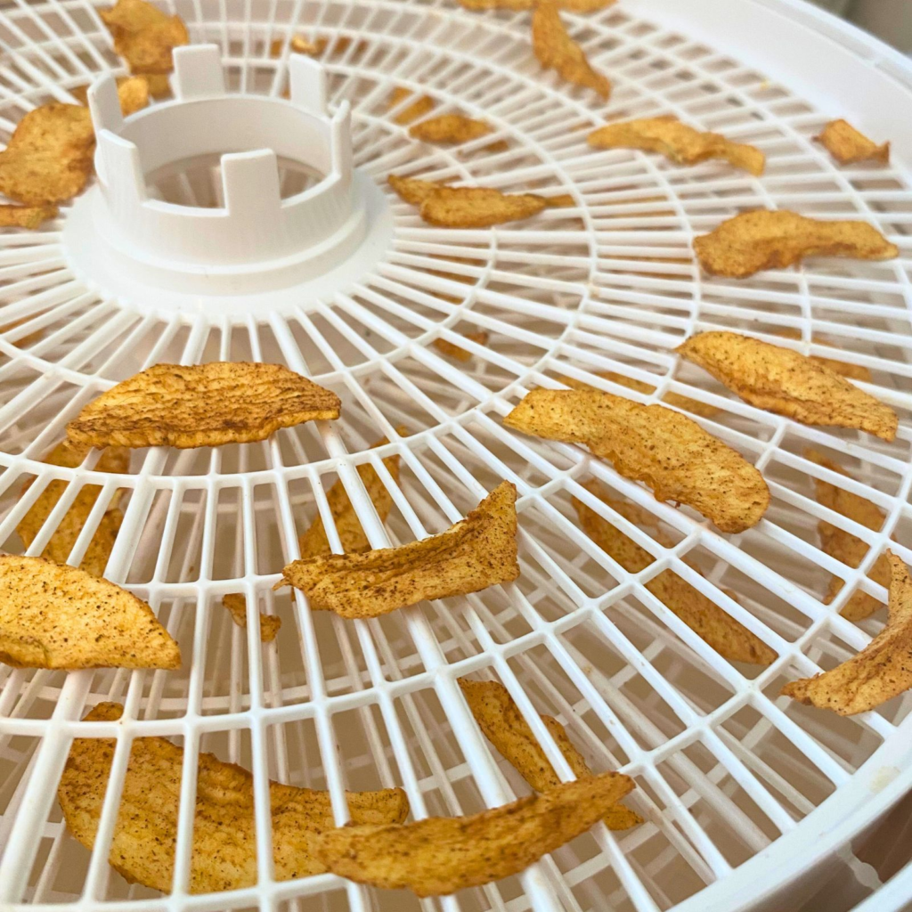 Dried apple slices in a dehydrator