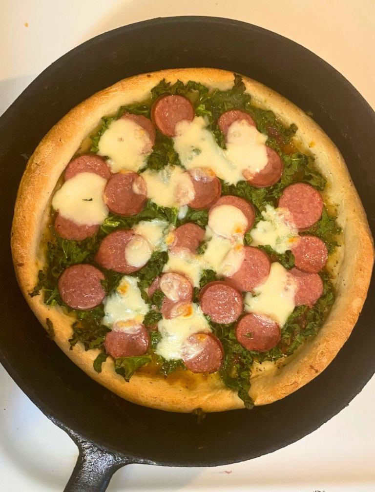 Homemade sourdough pizza in a cast-iron skillet